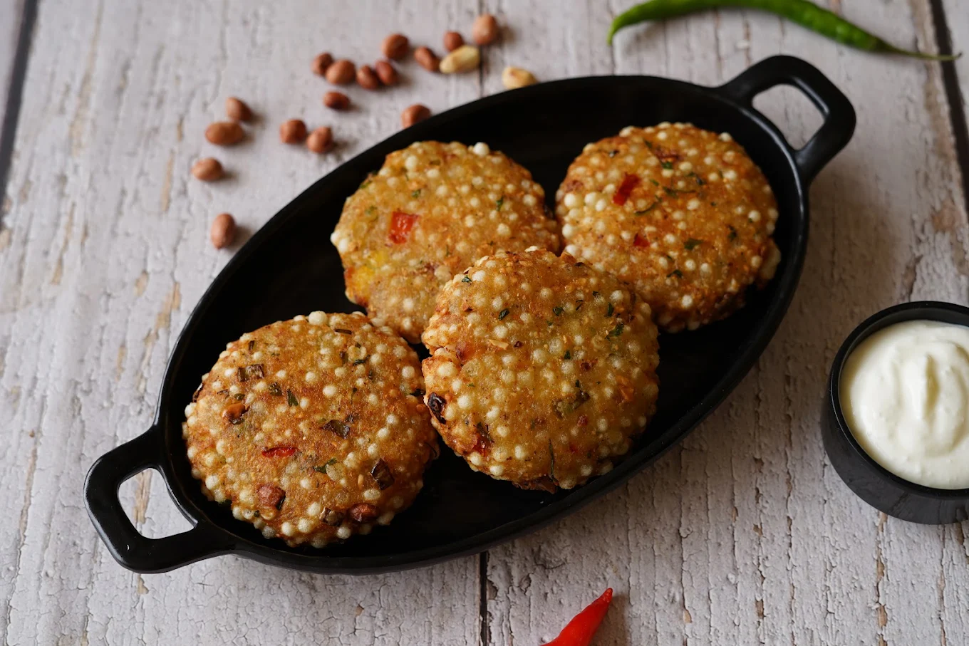 Crisp sabudana patties served with a creamy dip